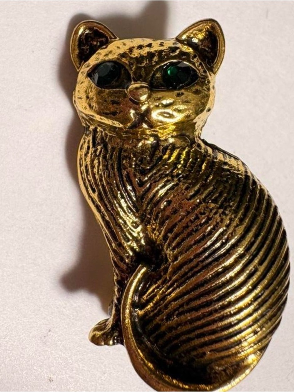 Vintage inspired gold tone Egyptian style Cat Brooch with Green rhinestone eyes